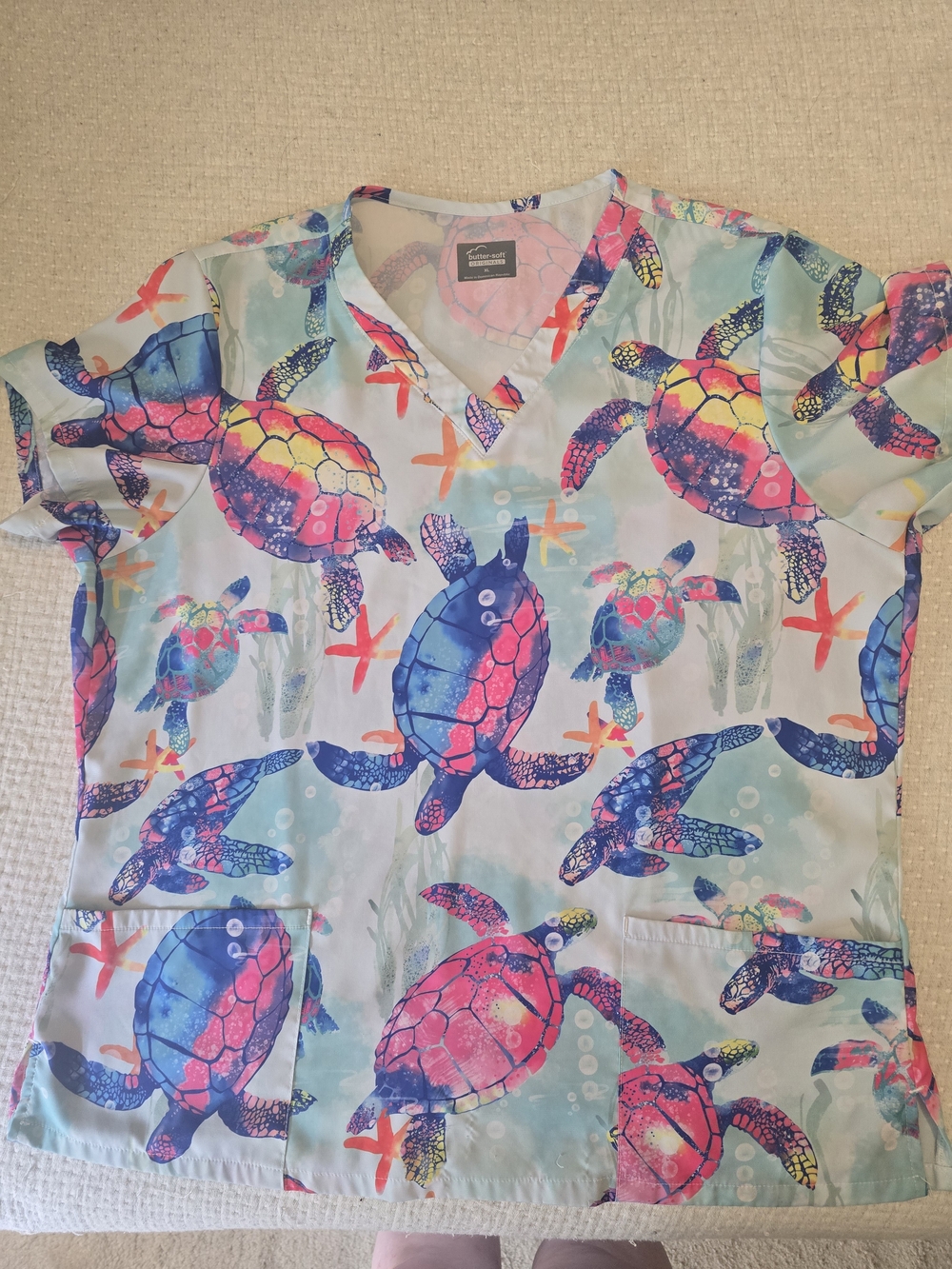 Butter Soft Sea Turtle Scrub Top in Light Blue and Pink Accents
